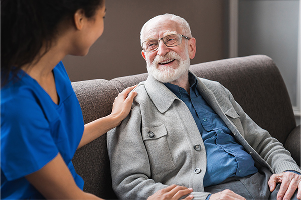 Care specialist assisting a Veteran at home