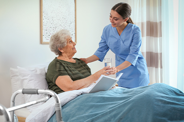 Care specialist assisting a Veteran at home
